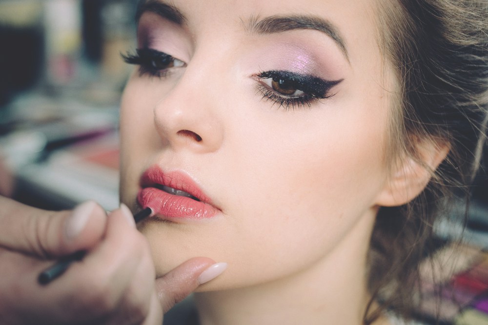 Beauty professional focused on styling details
