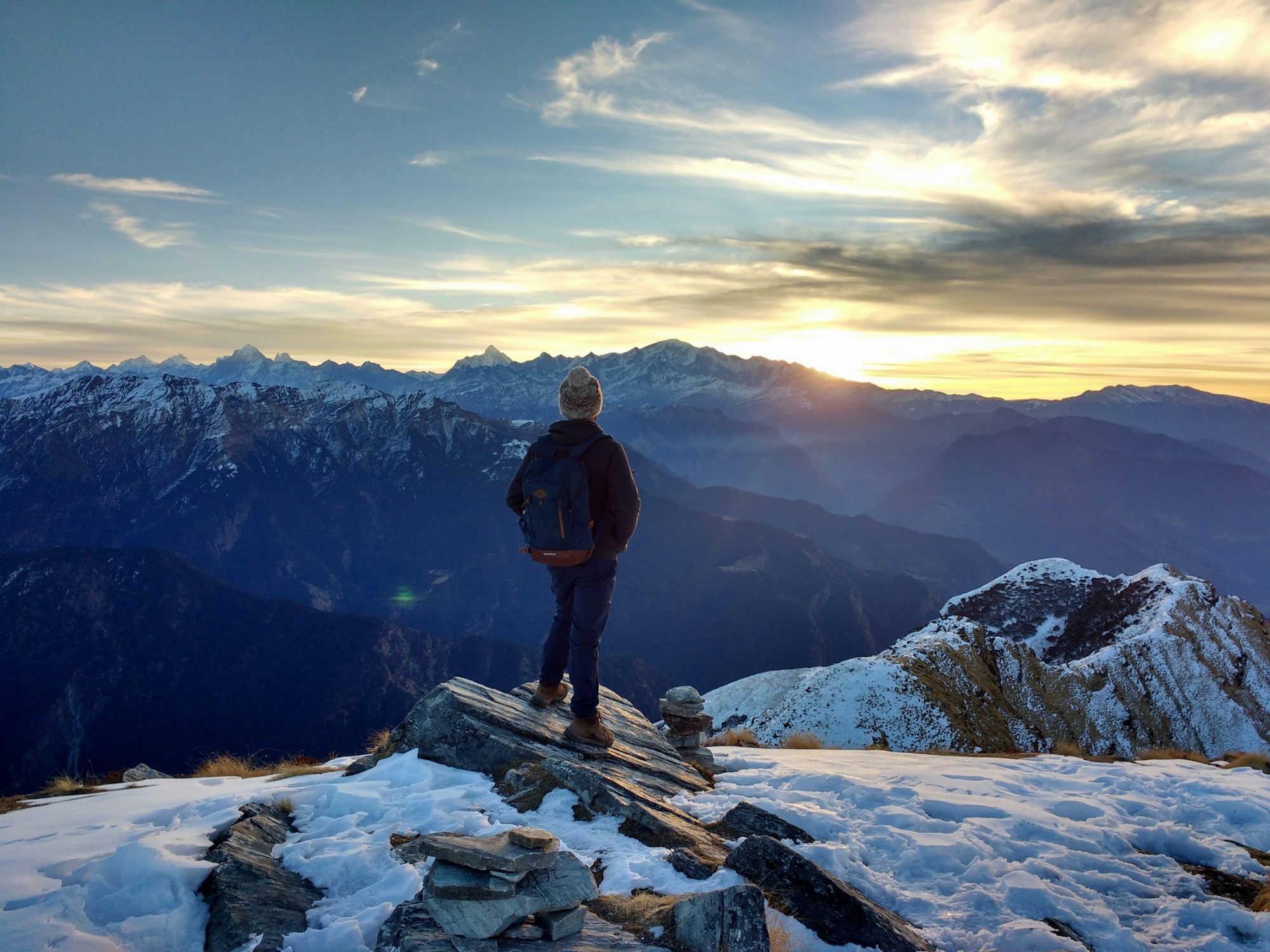 Person looking towards a mountain sunrise