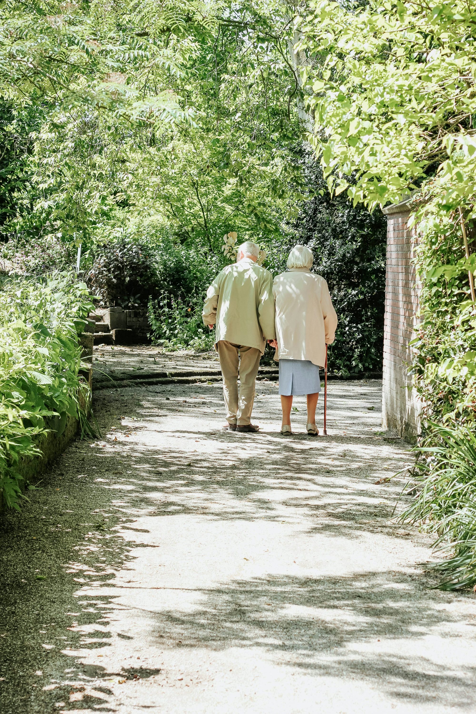 Older couple walking together outdoors