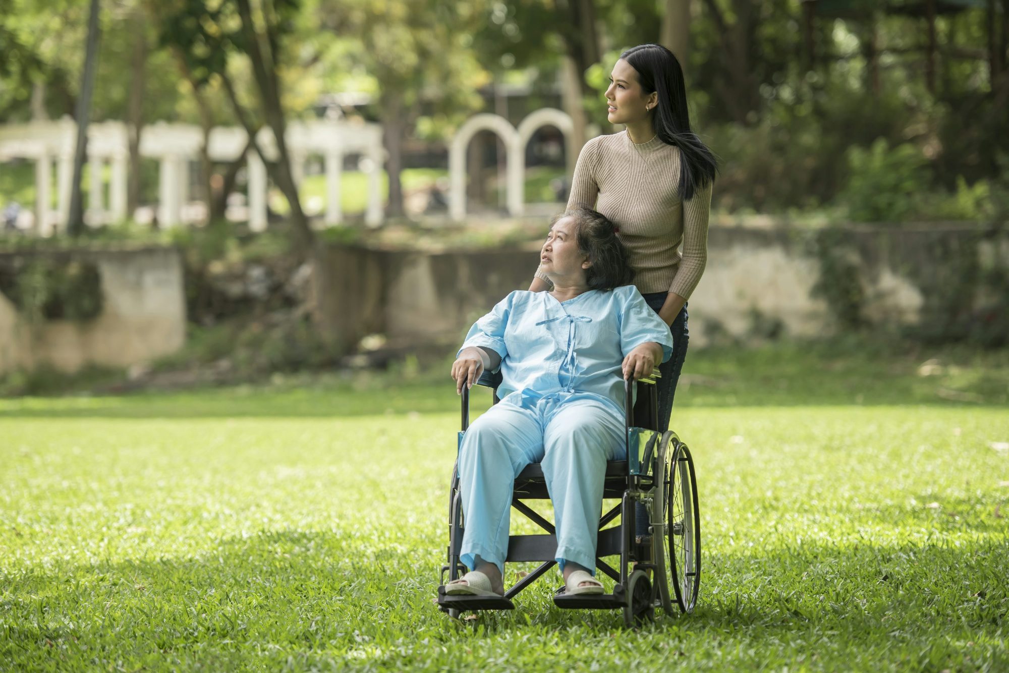 Senior woman and companion outdoors in a park