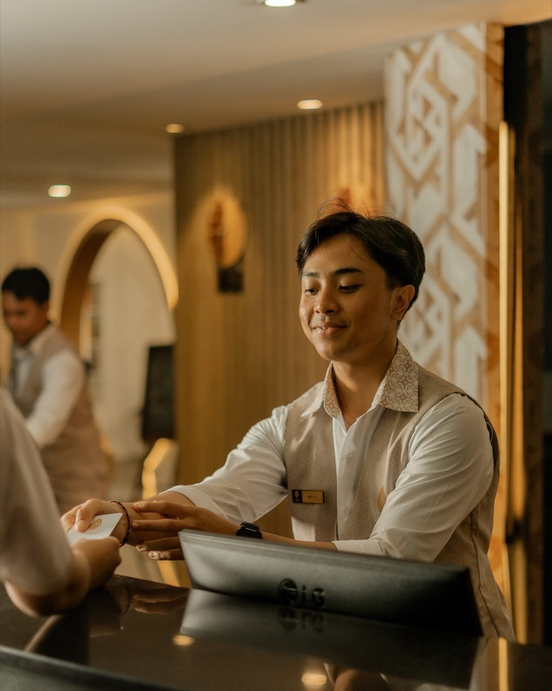 A host welcoming a guest