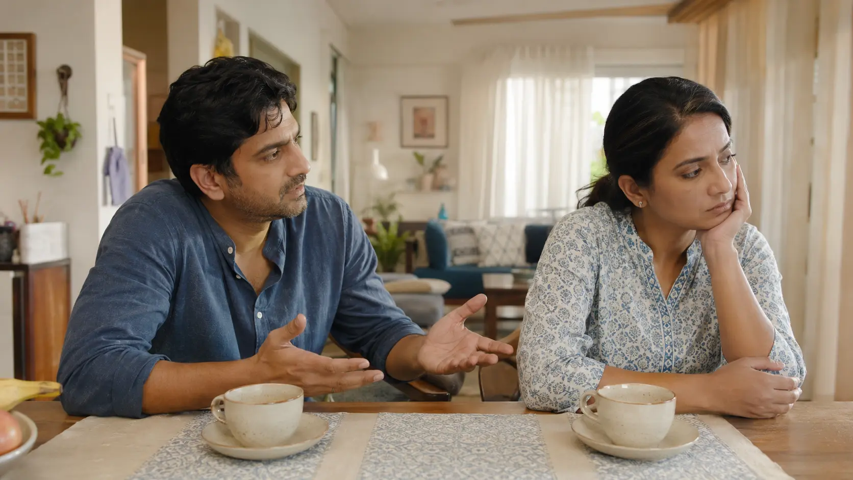 Indian couple experiencing a quiet relationship misunderstanding