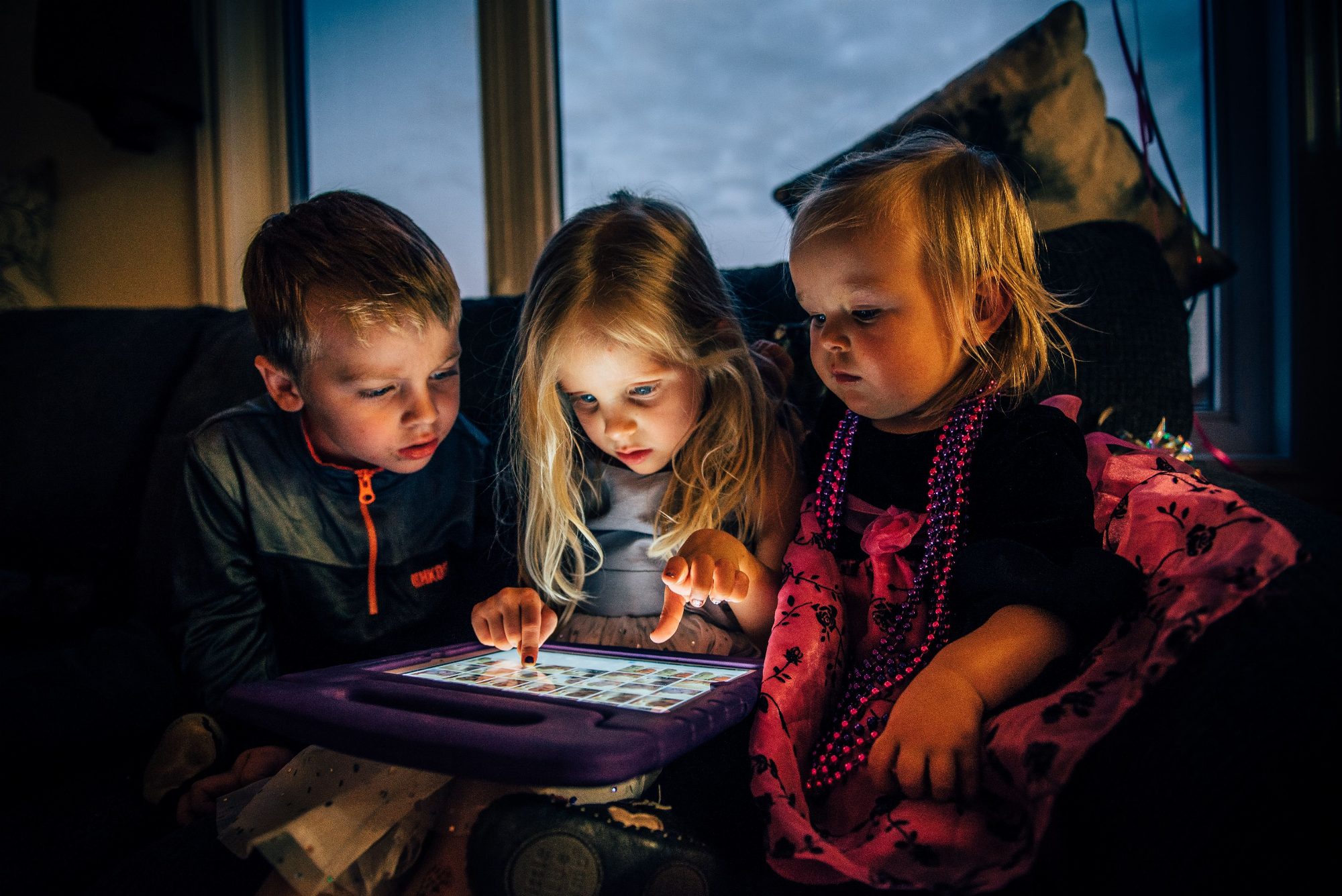 Child absorbed in tablet screen - relates to screen dependence content