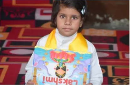 A child holding a story book