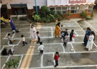 Children playing traditional games in the courtyard