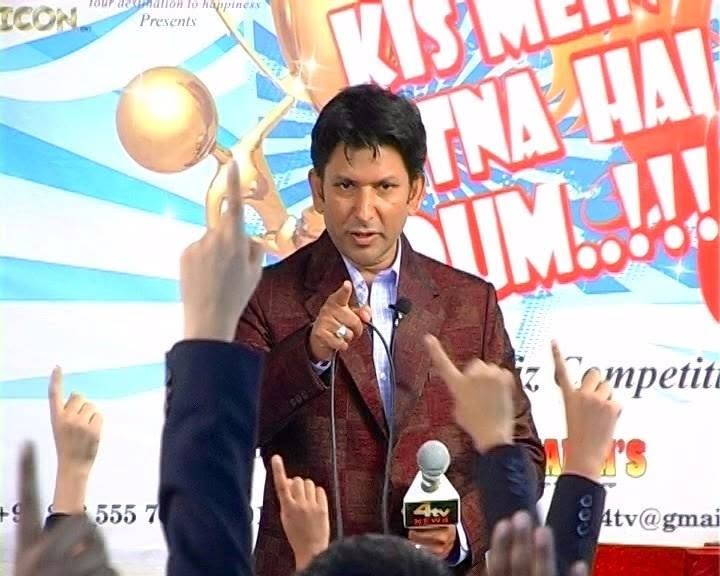 Ather Khan hosting a branded promotional event on stage