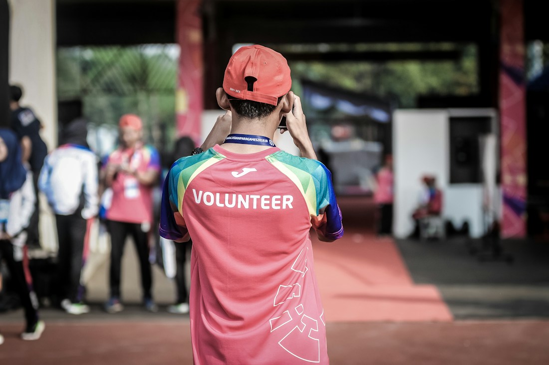 Volunteers helping people