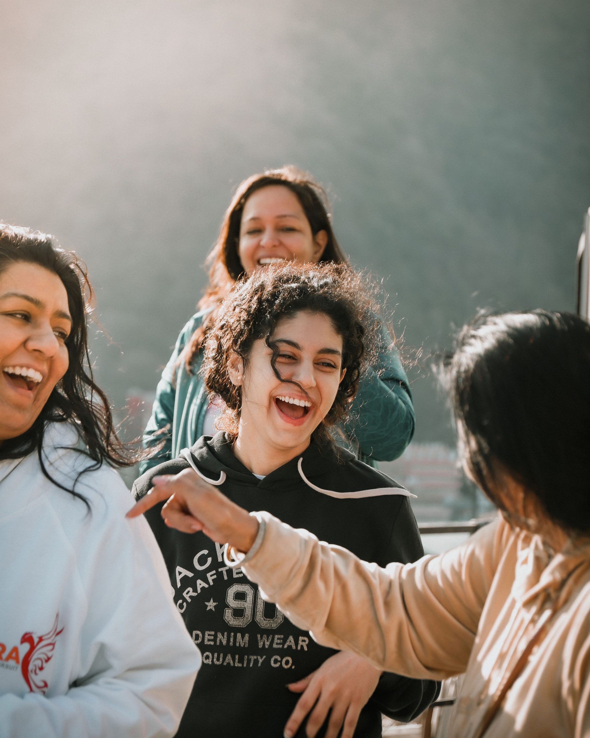 Women laughing together after healing