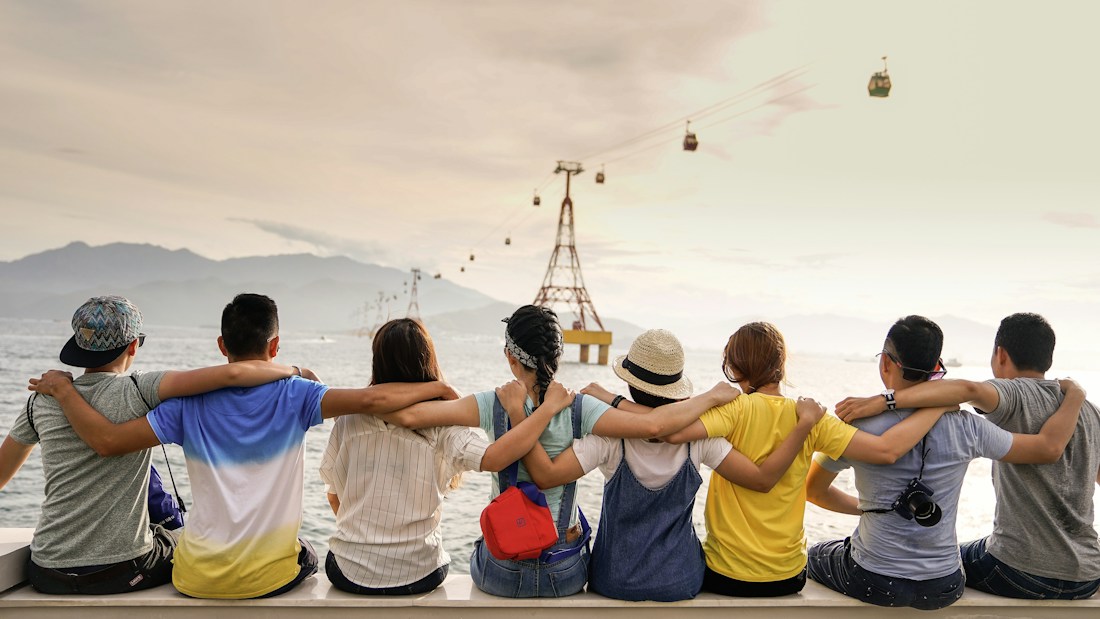 A diverse group of women sharing conversation outdoors