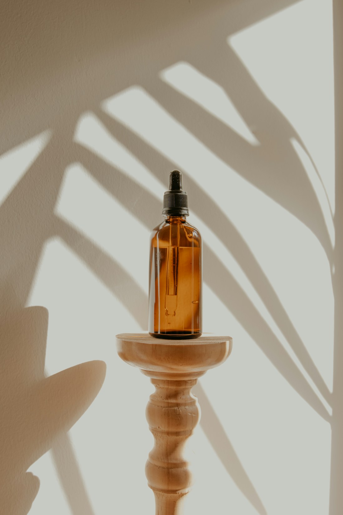 Glass bottles and botanical ingredients representing holistic wellness